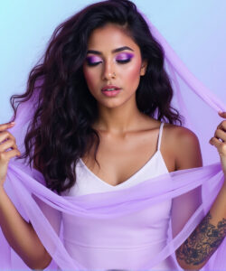 Photograph-of-a-beautiful-woman-with-wavy-black-hair-wearing-a-white-dress-holding-a-sheer-lavender-fabric