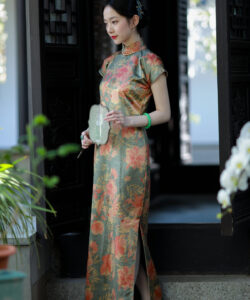 Asian woman in traditional chinese qipao dress holding a fan standing in front of a wooden door photograph