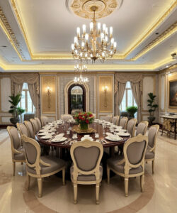 Luxurious-ornate-dining-room-with-chandelier-gold-accents-marble-floor-elegant-chairs-floral-centerpiece-and-classical-paintings