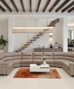Modern-minimalist-living-room-with-beige-sectional-sofa-wooden-staircase-potted-plants-and-contemporary-decor-on-a-tiled-floor
