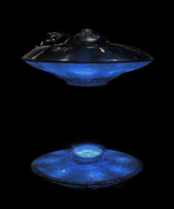 Photograph-of-a-glowing-blue-UFO-like-object-with-a-dome-and-circular-base-set-against-a-pitch-black-background