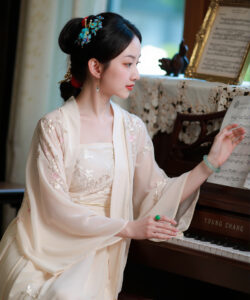 Photo medium 1girl portrait chinese woman playing the piano elegant traditional chinese clothing red lips red nails dark hair