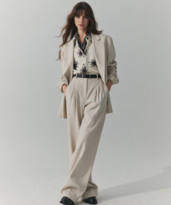 Chic Beige Suit Brunette Woman With Floral Blouse
