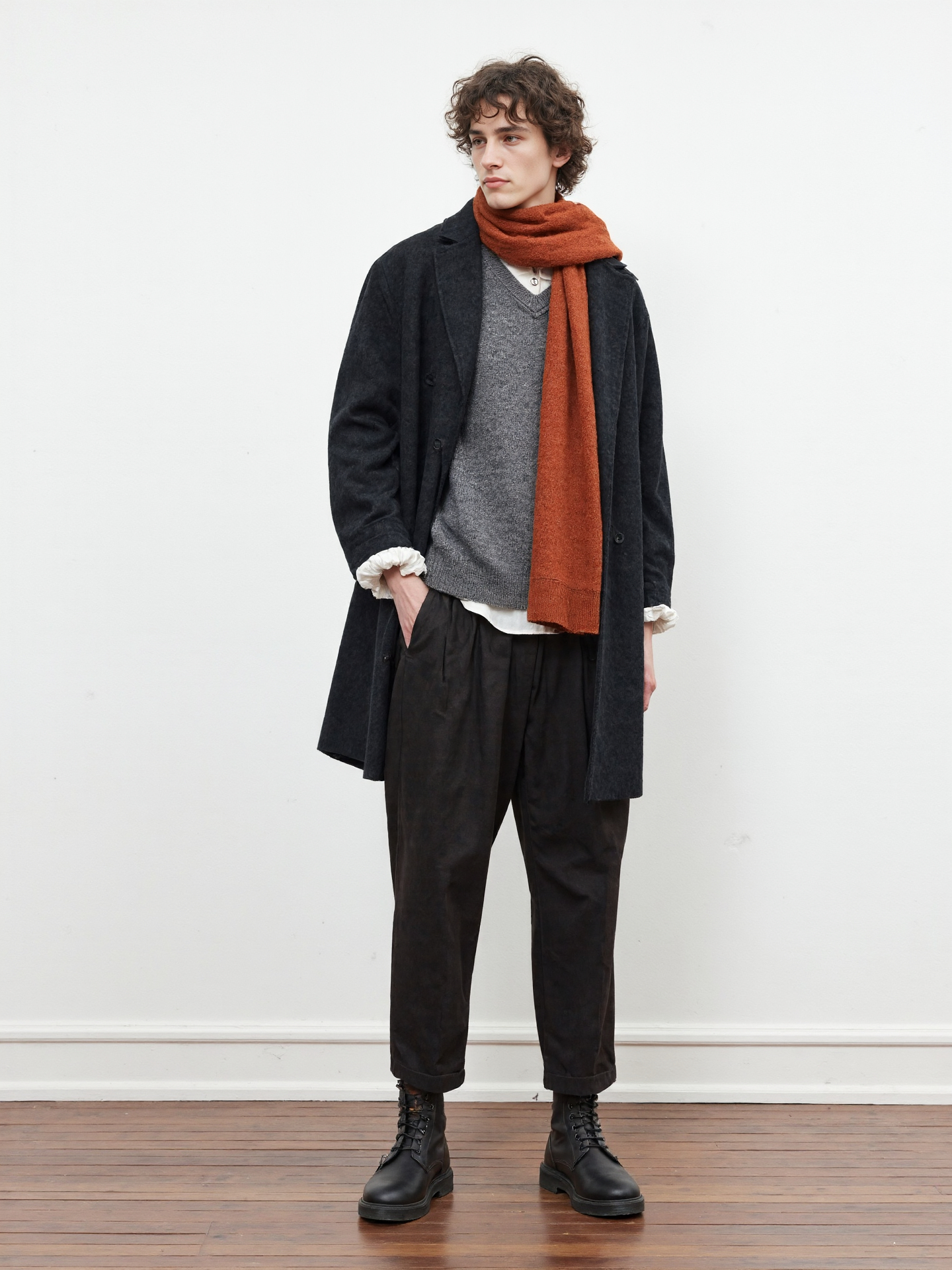 Cozy Winter Style Curly Haired Man In Black Coat Orange Scarf