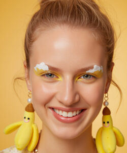 Fair Skinned Woman With Yellow Cloud Face Paint Banana Earrings Blonde Hair And A