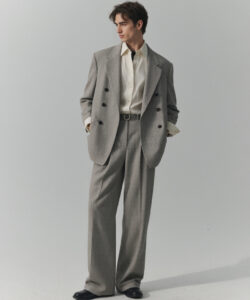 Light Skinned Man In A Gray Pinstripe Suit White Shirt Black Belt And Black