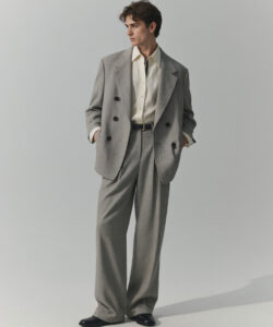 Man In A Grey Double Breasted Suit Suit White Shirt And Black Shoes Standing
