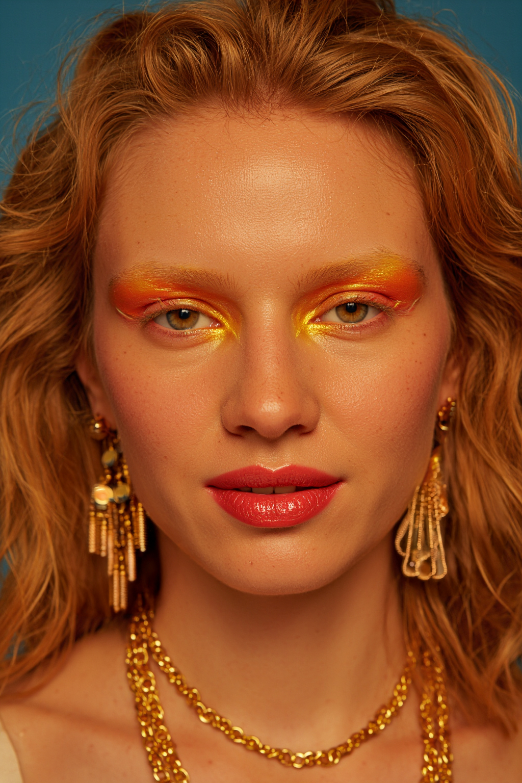 Skinned Blonde Woman With Vibrant Orange And And Yellow Eye Makeup Red Lipstick Gold 1