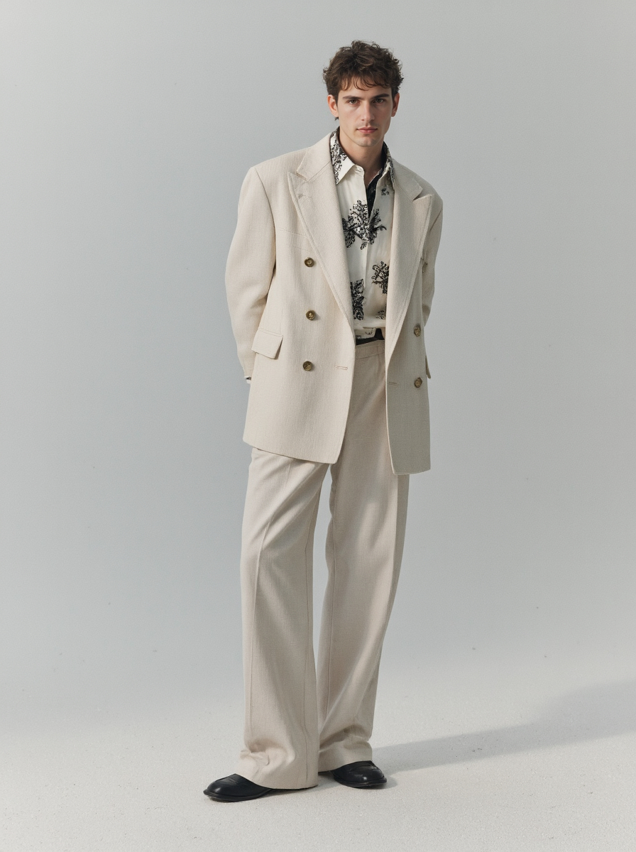 Skinned Man In A Cream Double Breasted Breasted Suit Black Shoes And Patterned Shirt